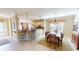 Open concept kitchen and dining area with granite countertops and stainless steel appliances at 417 Tomoka Dr, Englewood, FL 34223