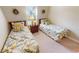 Bedroom with two twin beds, nightstand, and window at 417 Tomoka Dr, Englewood, FL 34223