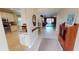 Entryway with kitchen and living room views at 417 Tomoka Dr, Englewood, FL 34223