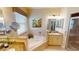 Bathroom with corner bathtub, double sinks and granite countertops at 417 Tomoka Dr, Englewood, FL 34223
