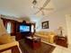 Bright living room featuring comfortable seating and a built-in entertainment center at 2573 Chynn Ave, North Port, FL 34286