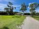 Single-story home with a long driveway and large yard at 2573 Chynn Ave, North Port, FL 34286