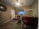 Small office with wood flooring and a bar at 2573 Chynn Ave, North Port, FL 34286