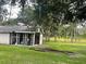 Outbuilding with a screened shelter at 2573 Chynn Ave, North Port, FL 34286