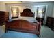 Elegant main bedroom showcasing a large bed and built-in dresser at 2573 Chynn Ave, North Port, FL 34286