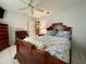 Cozy bedroom with a double bed, dresser, and ceiling fan at 2573 Chynn Ave, North Port, FL 34286