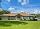 Single-story home with landscaping and a spacious yard at 2573 Chynn Ave, North Port, FL 34286