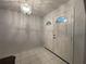 Bright entryway with double doors and a tiled floor at 2573 Chynn Ave, North Port, FL 34286