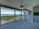 Large screened balcony with water views and ceiling fan at 6000 Boca Grande Cswy # D46, Boca Grande, FL 33921