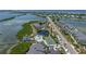 Aerial view showing community pool, tennis court, and waterfront access at 6000 Boca Grande Cswy # D46, Boca Grande, FL 33921