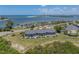 Aerial view of waterfront property with lush landscaping at 6000 Boca Grande Cswy # D46, Boca Grande, FL 33921
