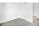 Simple bedroom with closet and grey tile flooring at 9309 Zorn St, Port Charlotte, FL 33981