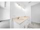 Bathroom with double vanity and modern light fixtures at 9262 Genesee St, Port Charlotte, FL 33981