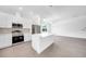 Modern kitchen with white cabinets, island, and herringbone backsplash at 9262 Genesee St, Port Charlotte, FL 33981