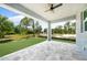 Relaxing covered patio with paver stones and a view of the backyard at 9262 Genesee St, Port Charlotte, FL 33981