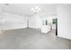 Open concept living room features tile floors and an island kitchen at 9262 Genesee St, Port Charlotte, FL 33981