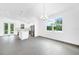 Open concept dining room with kitchen and large window at 9262 Genesee St, Port Charlotte, FL 33981