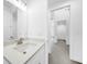 Bathroom with single vanity and modern light fixtures at 9262 Genesee St, Port Charlotte, FL 33981