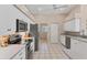 Kitchen with stainless steel appliances and white cabinets at 64 Long Meadow Ln, Rotonda West, FL 33947