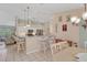 Kitchen with island and breakfast bar, open to living area at 64 Long Meadow Ln, Rotonda West, FL 33947