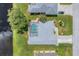 Bird's-eye view of home with pool and canal at 64 Long Meadow Ln, Rotonda West, FL 33947