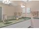 Bathroom with double vanity and large mirror at 64 Long Meadow Ln, Rotonda West, FL 33947
