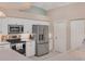 Kitchen features stainless steel appliances and white cabinetry at 64 Long Meadow Ln, Rotonda West, FL 33947