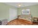 Bedroom with wood flooring and a pull-out sofa at 64 Long Meadow Ln, Rotonda West, FL 33947