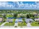 Aerial view of a residential neighborhood with houses and canals at 64 Long Meadow Ln, Rotonda West, FL 33947