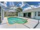 Screened-in pool with a large backyard view at 64 Long Meadow Ln, Rotonda West, FL 33947