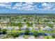 Wide view of community with various homes at 64 Long Meadow Ln, Rotonda West, FL 33947