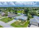 Aerial view of a residential neighborhood with houses and canals at 64 Long Meadow Ln, Rotonda West, FL 33947