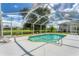 Screened-in pool with a large backyard view at 64 Long Meadow Ln, Rotonda West, FL 33947