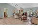 Living room with tile floors, vaulted ceilings, and comfortable seating at 64 Long Meadow Ln, Rotonda West, FL 33947