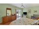 Main bedroom with king bed, dresser, and backyard access at 64 Long Meadow Ln, Rotonda West, FL 33947