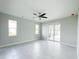 Bright and airy living room with tile floors and sliding glass doors at 5240 Willow Lake Ct, Sarasota, FL 34233