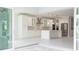 Open concept kitchen and living space with access to the backyard at 5240 Willow Lake Ct, Sarasota, FL 34233