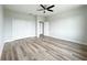 Bright bedroom with wood-look floors and double door closet at 5240 Willow Lake Ct, Sarasota, FL 34233