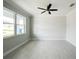 Bright living room with tile floors and ceiling fan at 5240 Willow Lake Ct, Sarasota, FL 34233