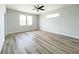 Bright bedroom with wood-look flooring and ceiling fan at 5240 Willow Lake Ct, Sarasota, FL 34233