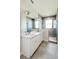 Bathroom with double vanity, marble countertop and large shower at 5240 Willow Lake Ct, Sarasota, FL 34233