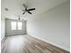 Spacious bedroom with wood flooring and ceiling fan at 5240 Willow Lake Ct, Sarasota, FL 34233