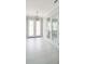 Bright foyer with white tile floors and french doors at 5240 Willow Lake Ct, Sarasota, FL 34233