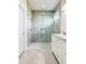 Spa-like bathroom with a large walk-in shower and double vanity at 5240 Willow Lake Ct, Sarasota, FL 34233