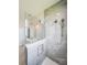 Large walk-in shower with gray tile and glass enclosure at 5240 Willow Lake Ct, Sarasota, FL 34233