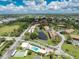 Community overview with pool, and highlighted condo building at 3 Quails Run Blvd # 8, Englewood, FL 34223