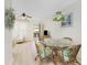 Dining area with view of living room and balcony at 3 Quails Run Blvd # 8, Englewood, FL 34223