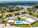 Community pool, tennis courts and condo buildings at 3 Quails Run Blvd # 8, Englewood, FL 34223