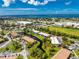 Aerial view showing condo building near water at 3 Quails Run Blvd # 8, Englewood, FL 34223