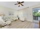 Living room with access to a balcony at 3 Quails Run Blvd # 8, Englewood, FL 34223